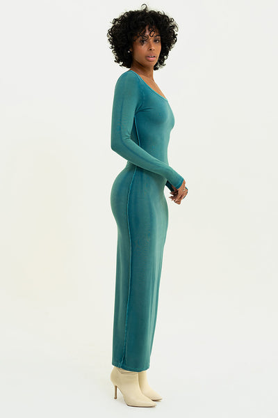 Side perspective of the Lonnie Dress in Washed Jade, highlighting the dress’s contoured fit.