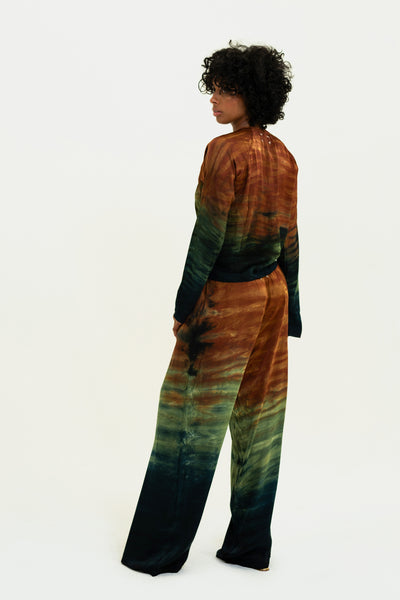 Rear view of model in Monaco Pant and Tai Top set in Desert, revealing the detailed tie-dye and sleek silhouette.