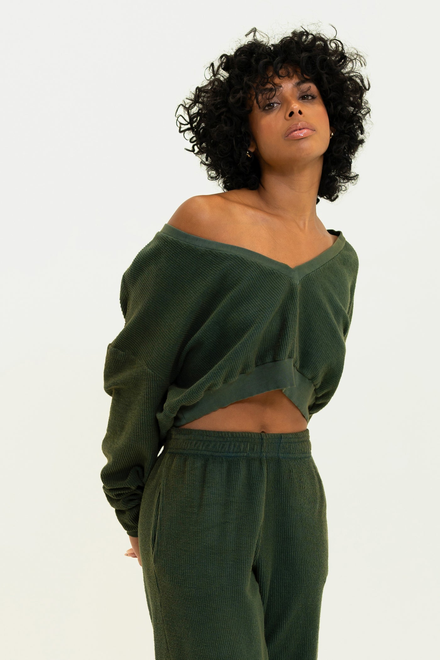 Olive Aspen Pullover featuring a sensual deep V-neck, made from breathable, soft corded terry fabric for a distinctive look.