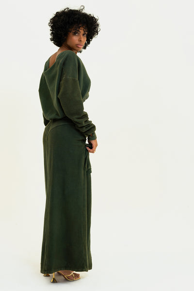 Model showcasing the back of the Olive Aspen Cargo Skirt. Made in the USA