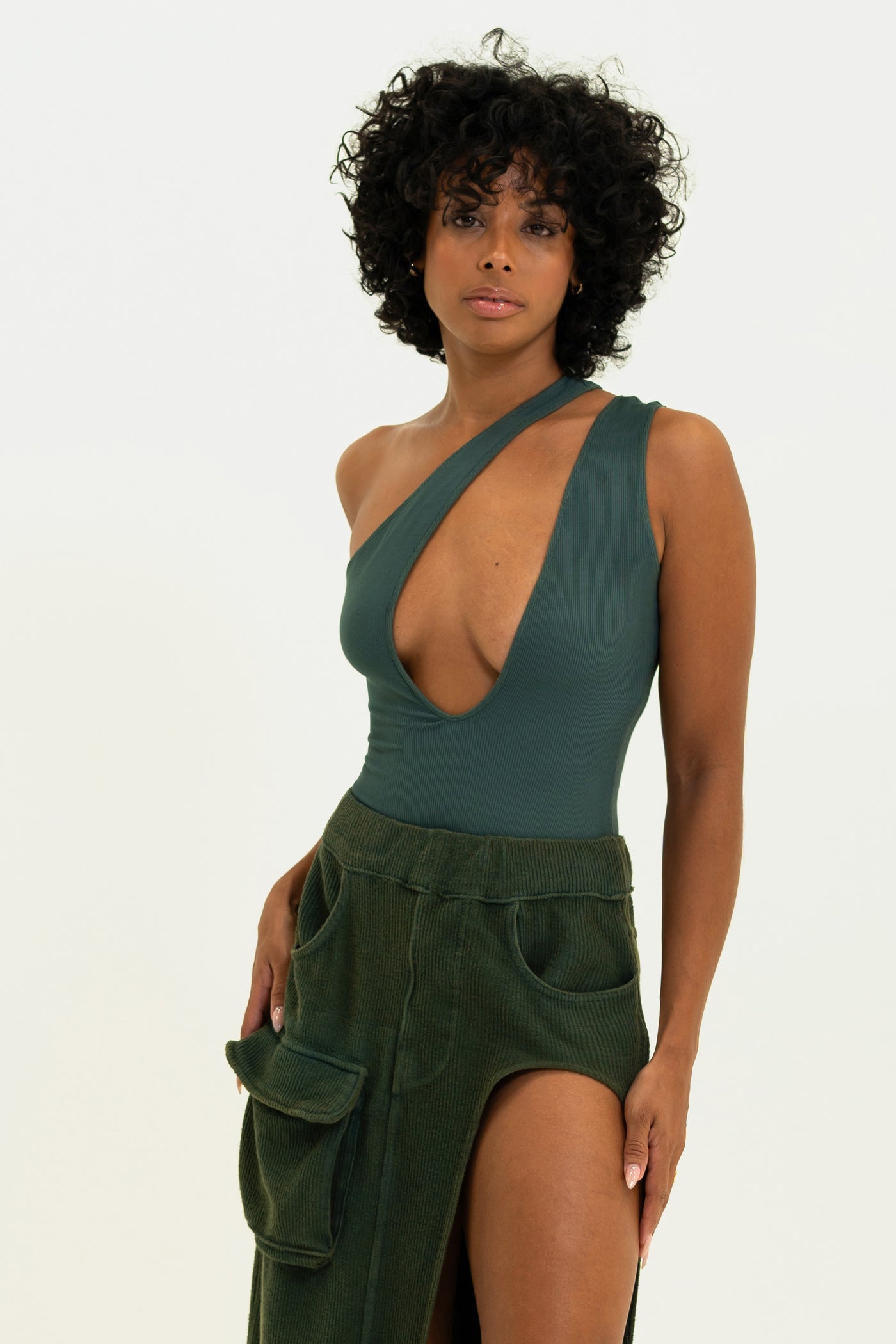 Model showcasing the Vintage Souls lightweight Bodysuit in Olive green color.