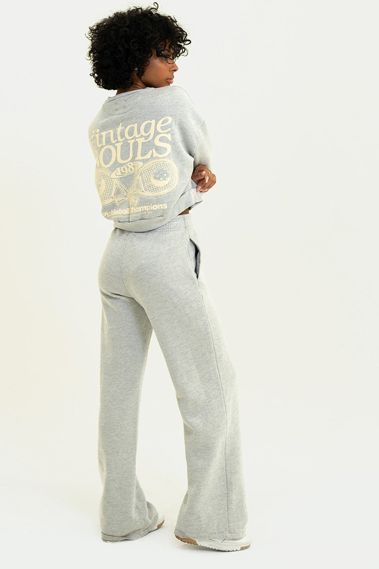 Back view of Heather Grey Chloe Pants, highlighting the elastic waistband and sleek fit.
