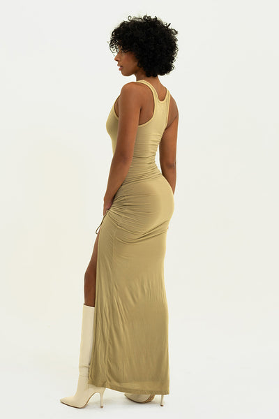 Rear view of the Sand Lola Dress on model - Emphasizing the unique back design and versatile slit.