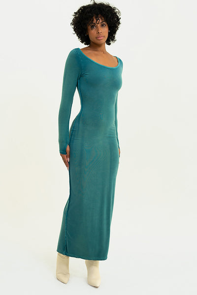 Model in the Washed Jade Lonnie Dress, displaying the dress's thumb hole details and flattering open neck design.