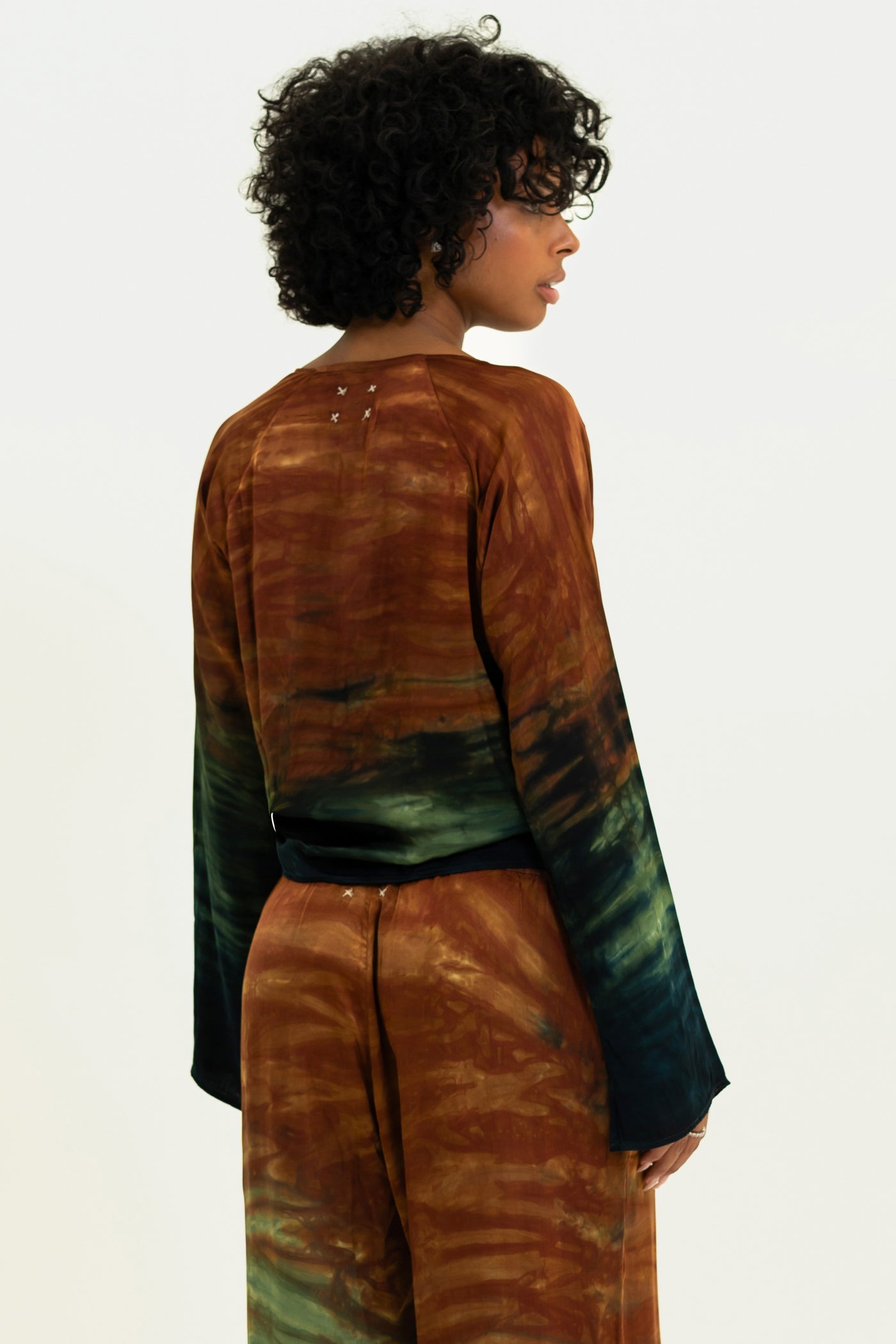Back view of Monaco Tai Top in Desert, showing unique tie-dye detail with matching pants.